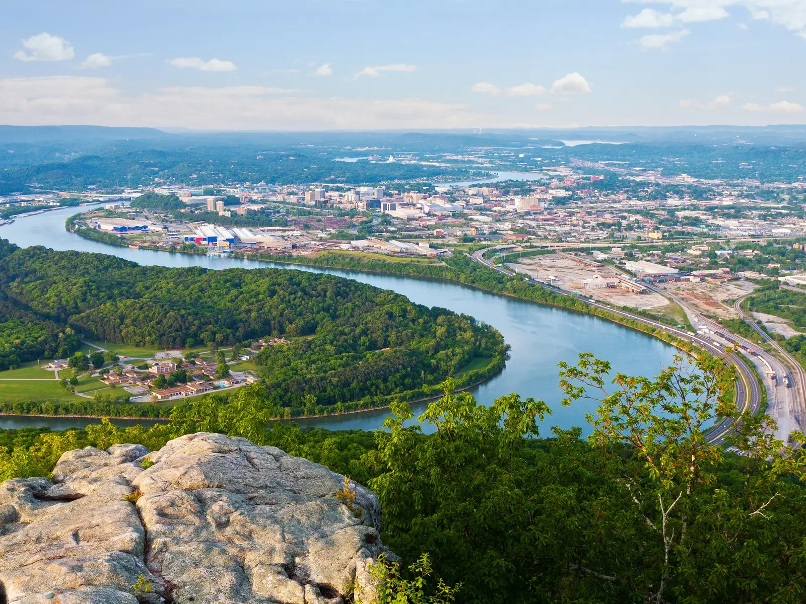 Chattanooga, Tennessee seen from Lookout Mountain: the Tennessee River curving around Moccasin Bend, with tree-covered ridges in the foreground